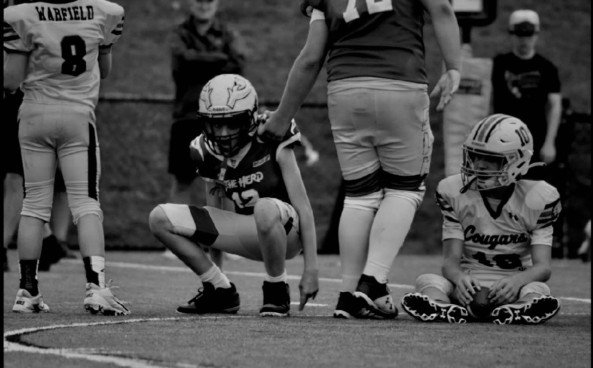Friday night football players on the field